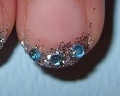 Bridal manicure with blue gems